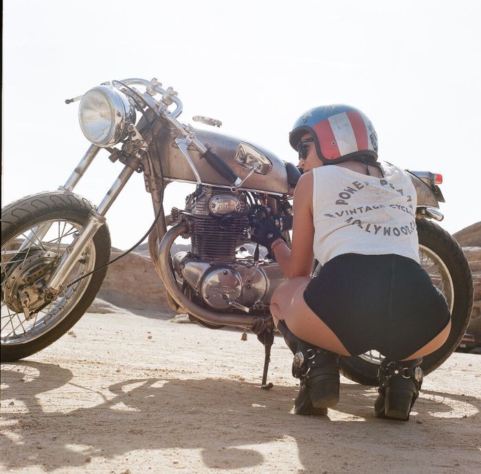 A playful frame from Girls on a motorcycle — online in Zhengzhou